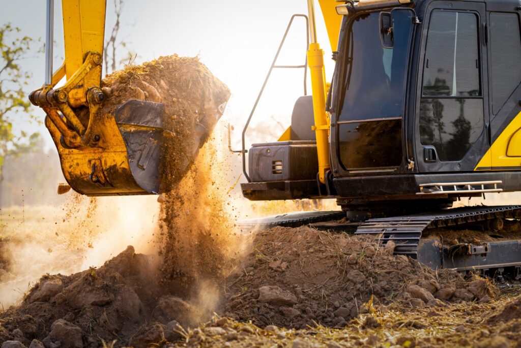 Close Up Image Of Excavator Digging Up Soil